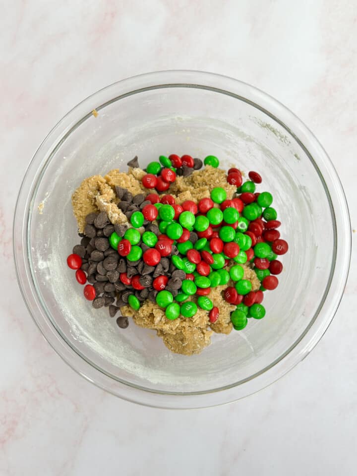 adding m&m's and chocolate chips.
