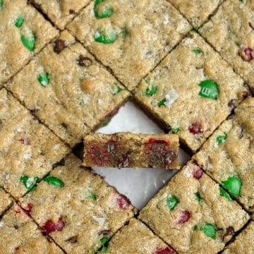 a single chewy christmas blondie turned up so you can see the texture inside.