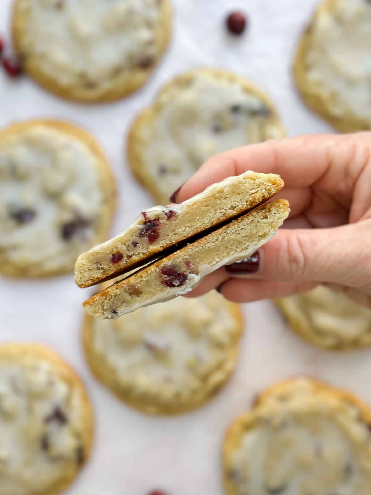 a lemon cranberry cookie cut in half to see inside.