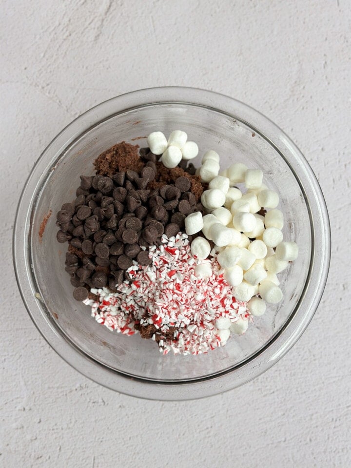 adding marshmallows, peppermint candies and chocolate chips.