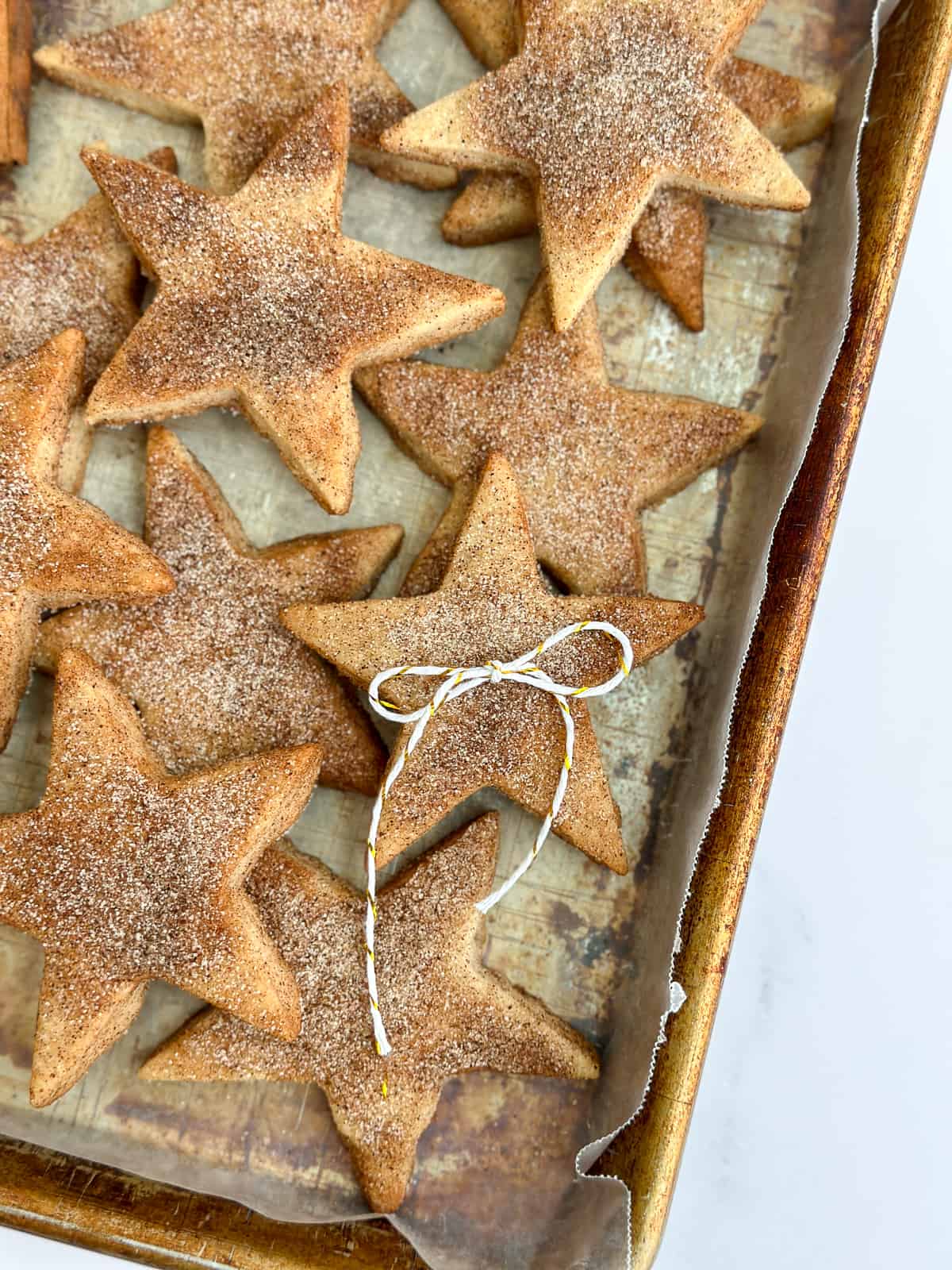 a bunch of cinnamon shortbread cookies stacked with a bow on top.