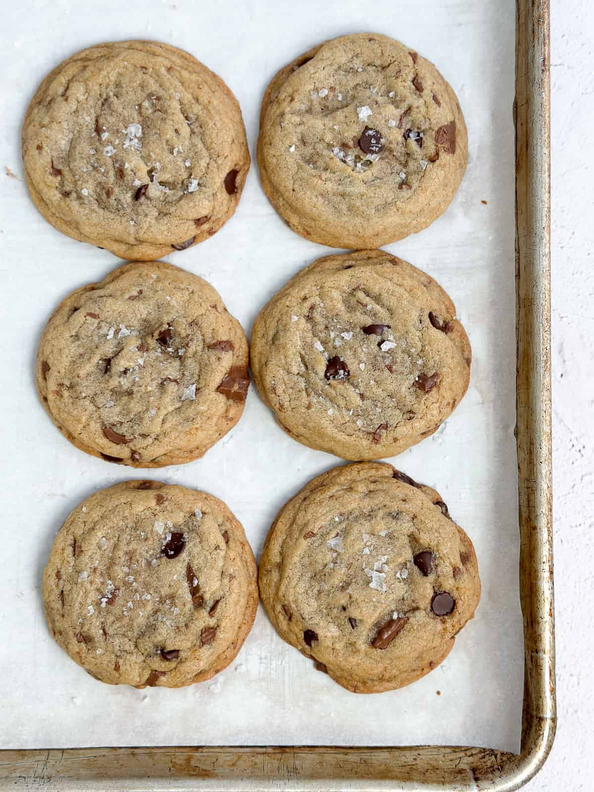 a close up of all 6 cookies on a baking sheet.