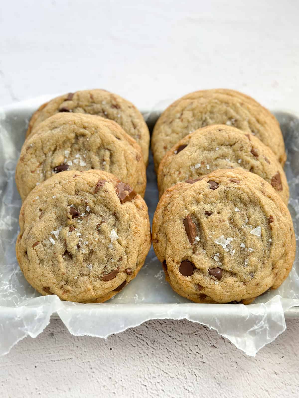 6 small batch brown butter chocolate chip cookies stacked together.