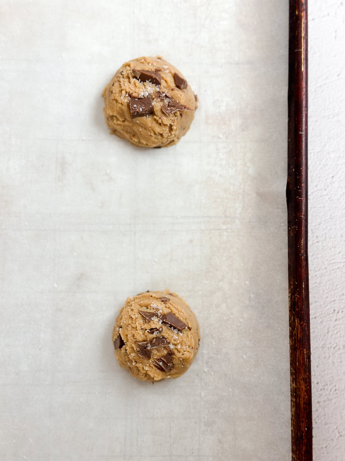 a closeup of cookie dough balls before baking.