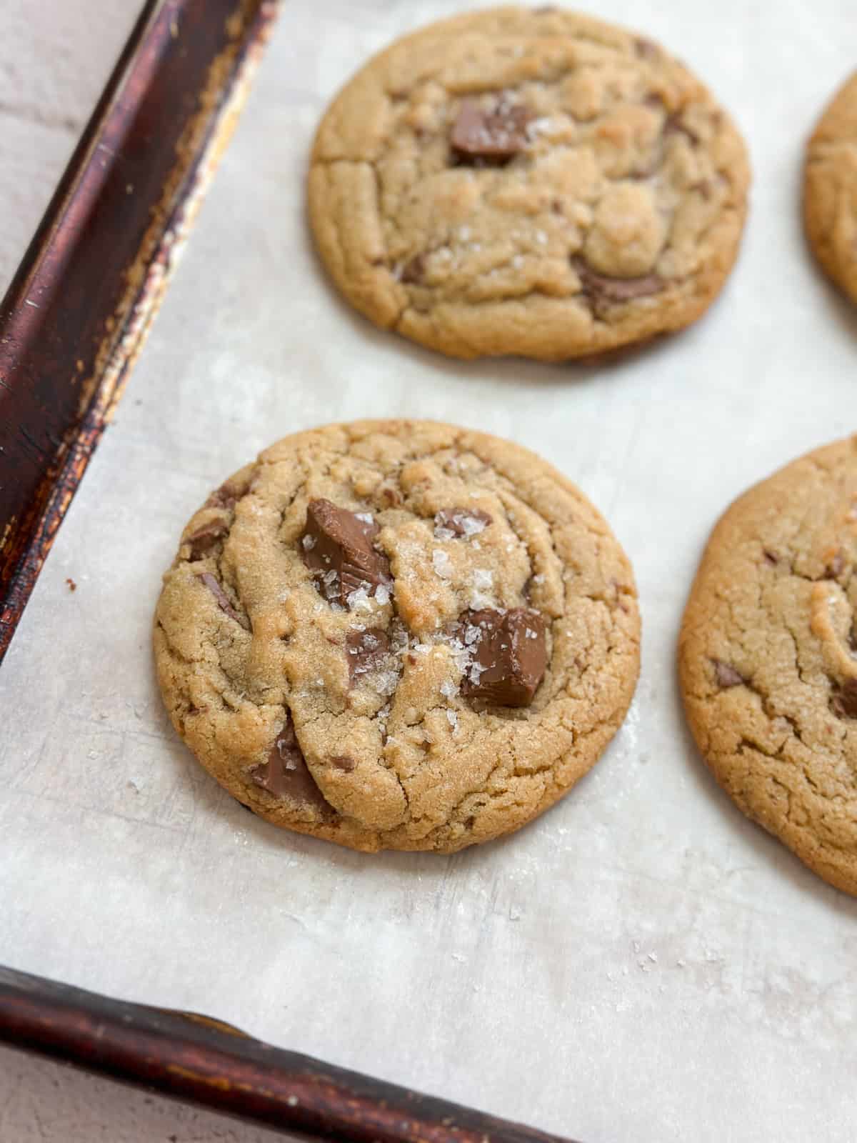 a brown butter peanut butter cookie on a baking sheet.
