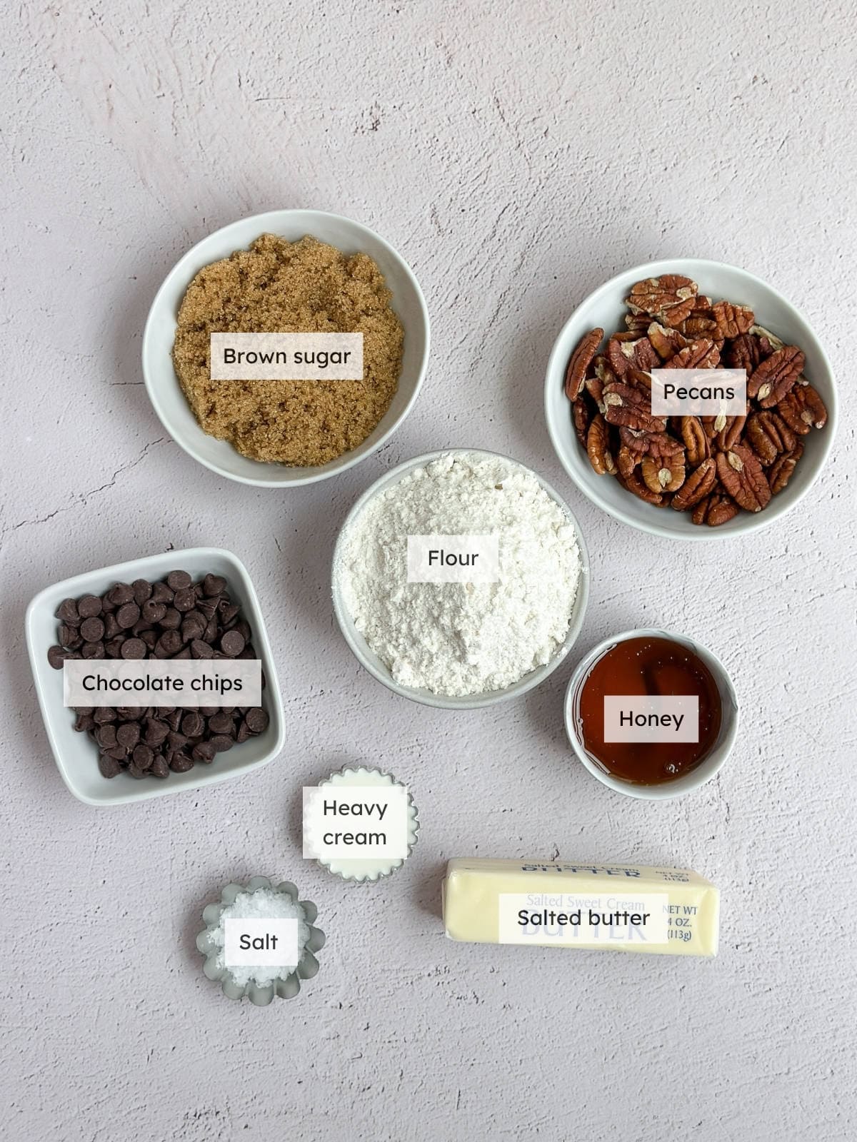 All of the ingredients needed to make Chocolate Pecan Bars.