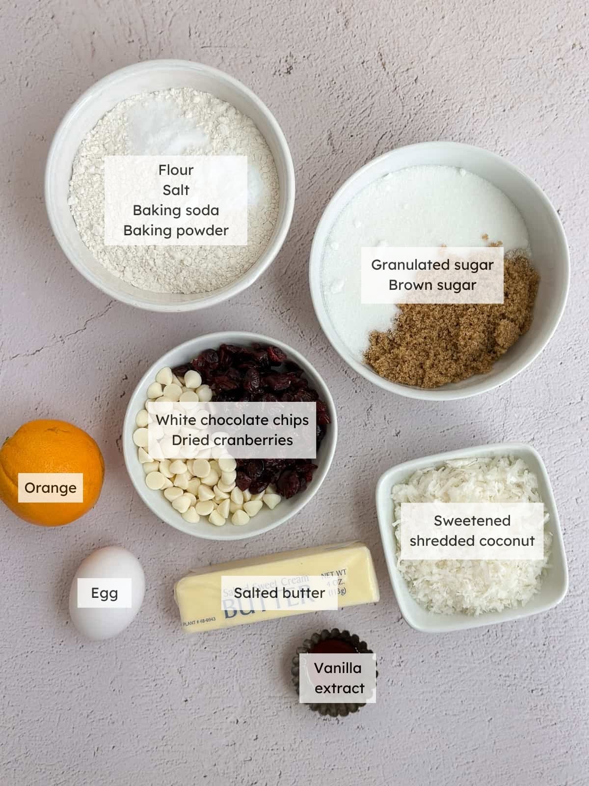 All the ingredients needed to make White chocolate cranberry orange cookies.