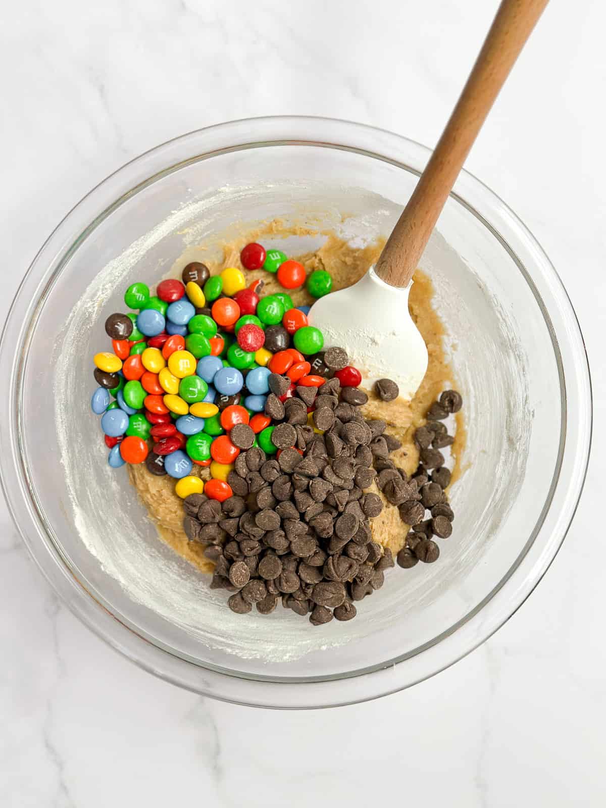 adding in the m&m's and chocolate chips.