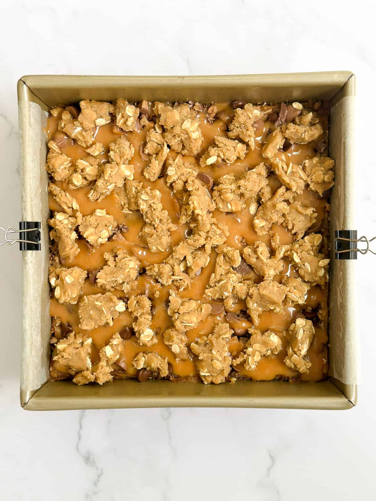 the bars with the rest of the dough broken into pieces and placed on top.
