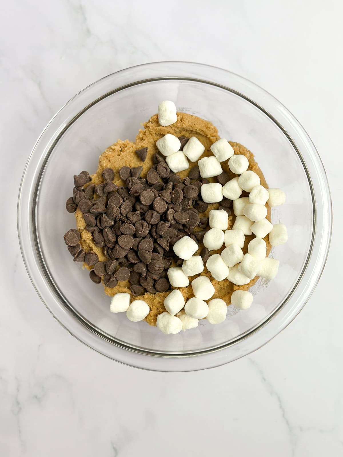 adding in the marshmallows and chocolate chips.