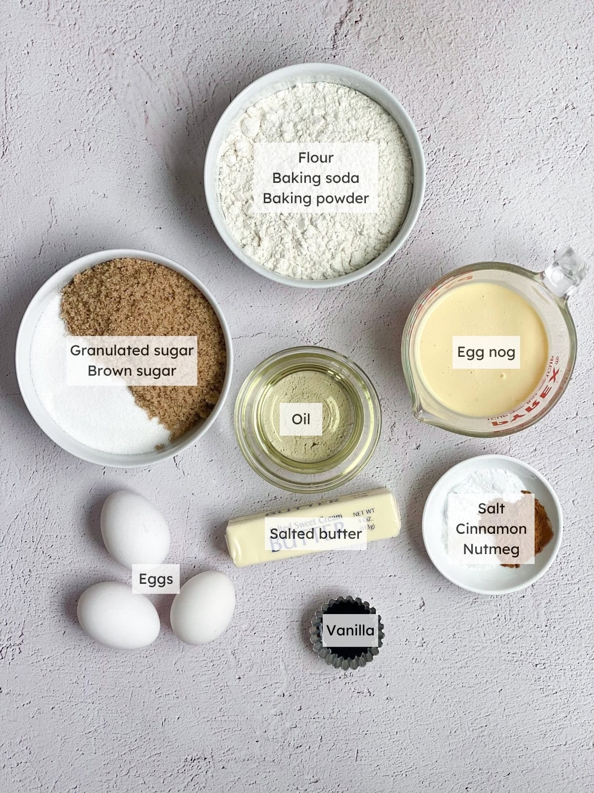 All of the ingredients needed to make egg nog bundt cake.