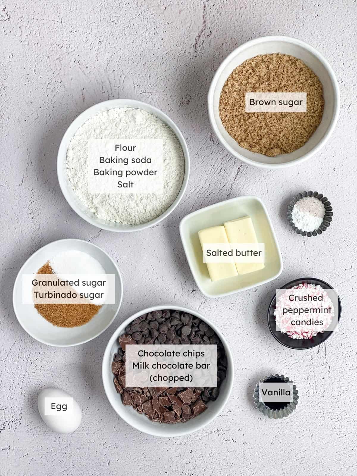 All of the ingredients needed to make peppermint chocolate chip cookies.