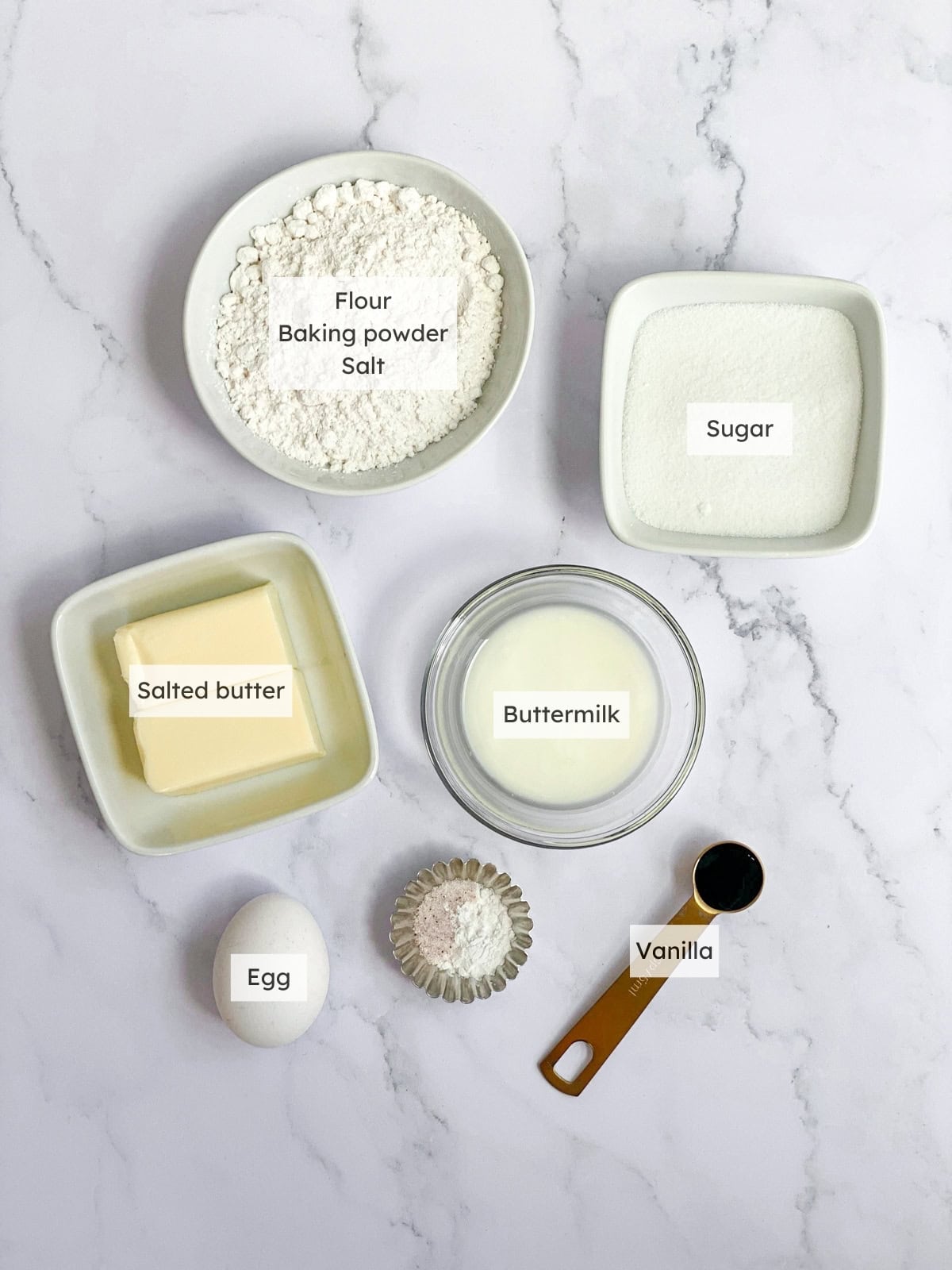 All the ingredients needed to make small batch vanilla cupcakes.