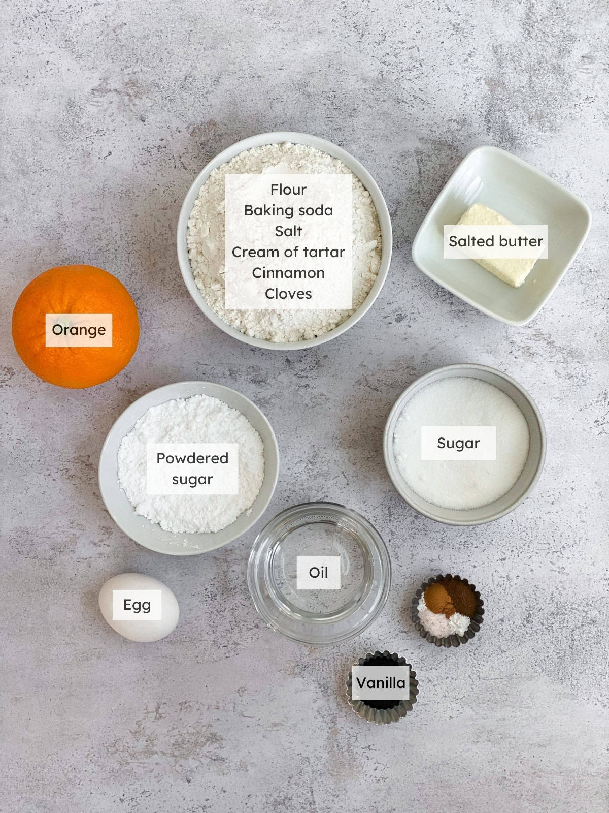 All of the ingredients needed to make spiced orange sugar cookies.