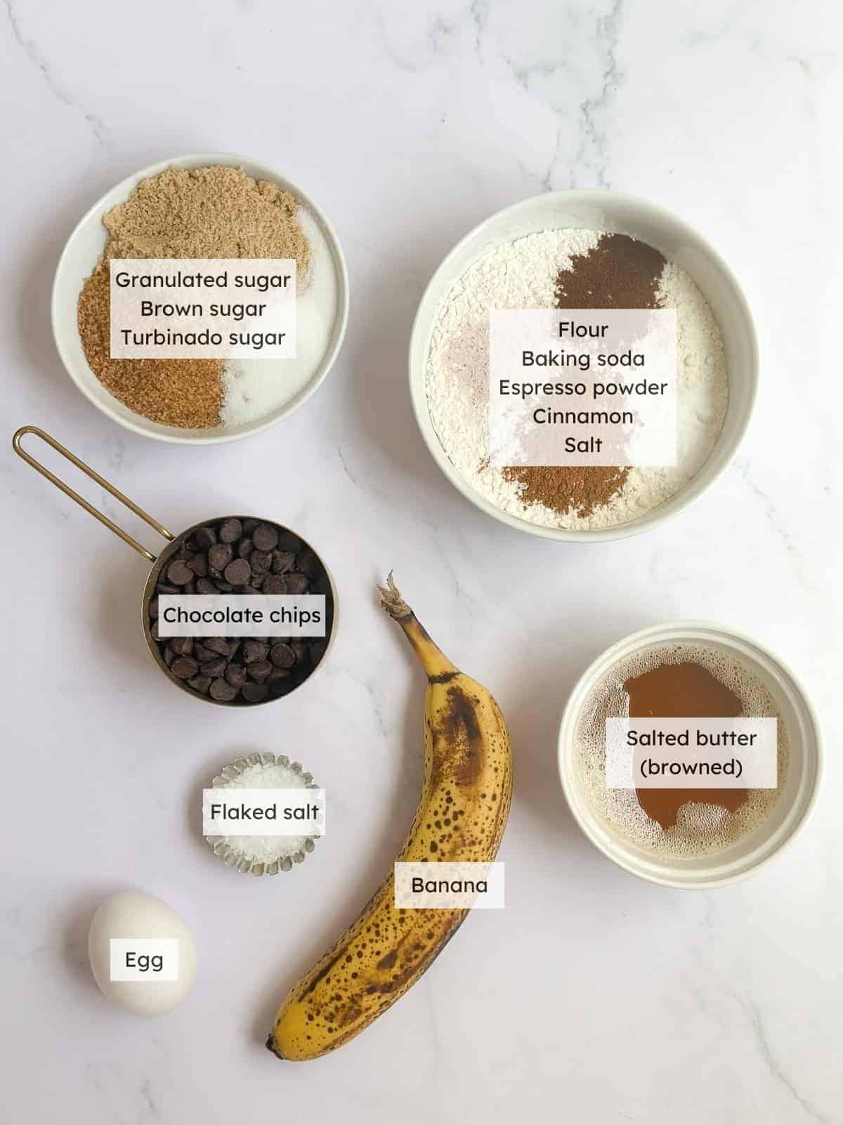 All of the ingredients needed to make banana chocolate chip cookies.