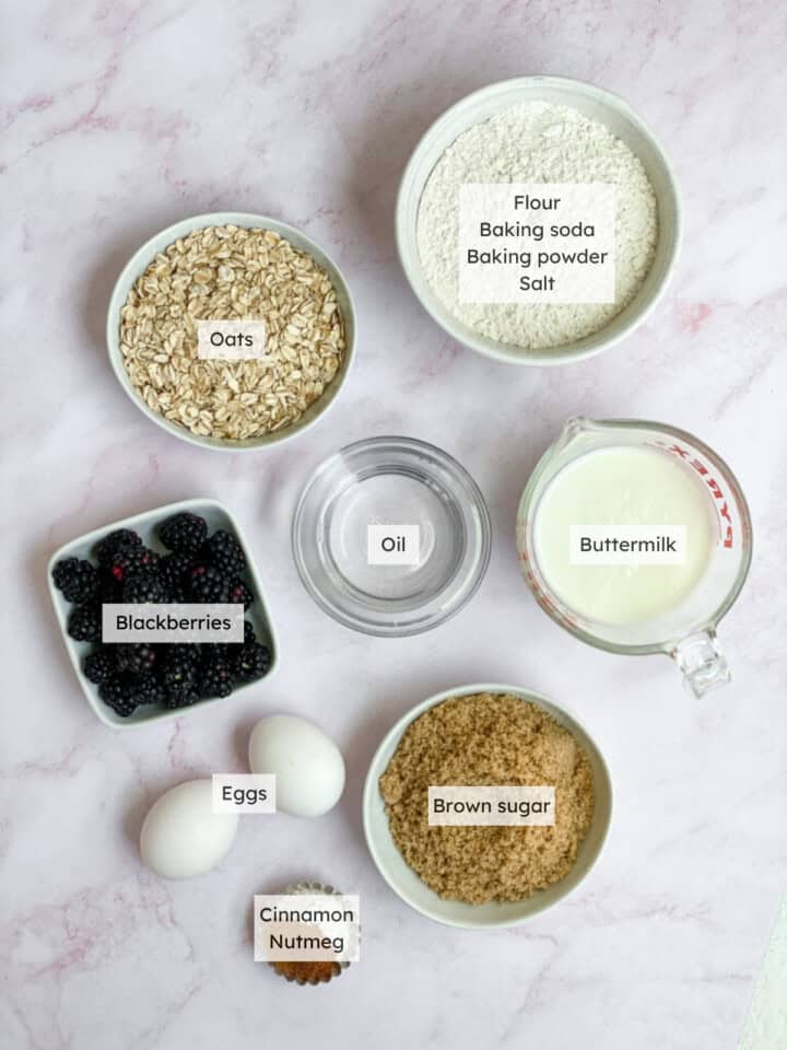 All the ingredients needed to make blackberry oatmeal muffins.