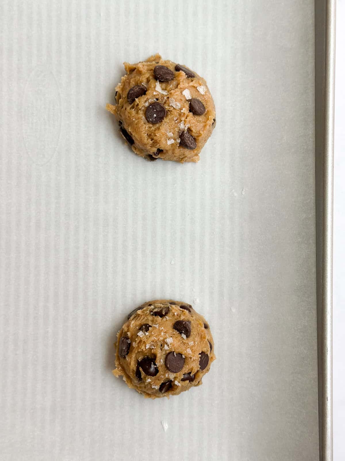 cookie dough on a baking sheet before baking.