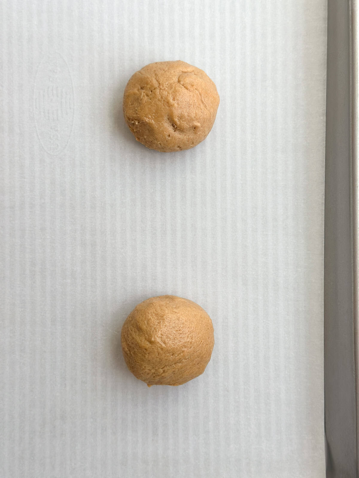 cookie ball before baking on cookie sheet.
