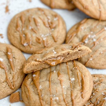 a close up of a cookie butter cookie with biscoff oozing from the inside.