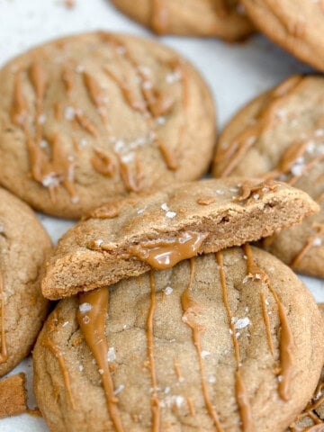 a close up of a cookie butter cookie with biscoff oozing from the inside.