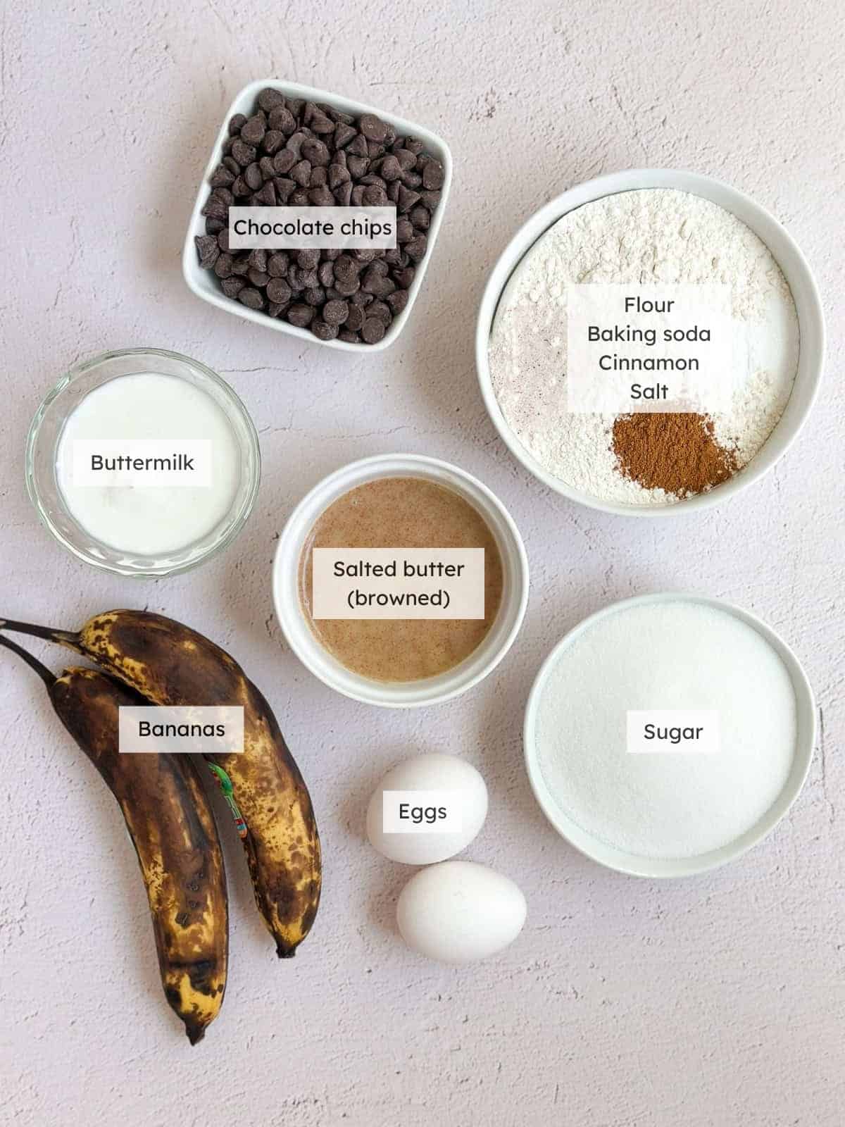 All of the ingredients needed for chocolate chip banana bread.