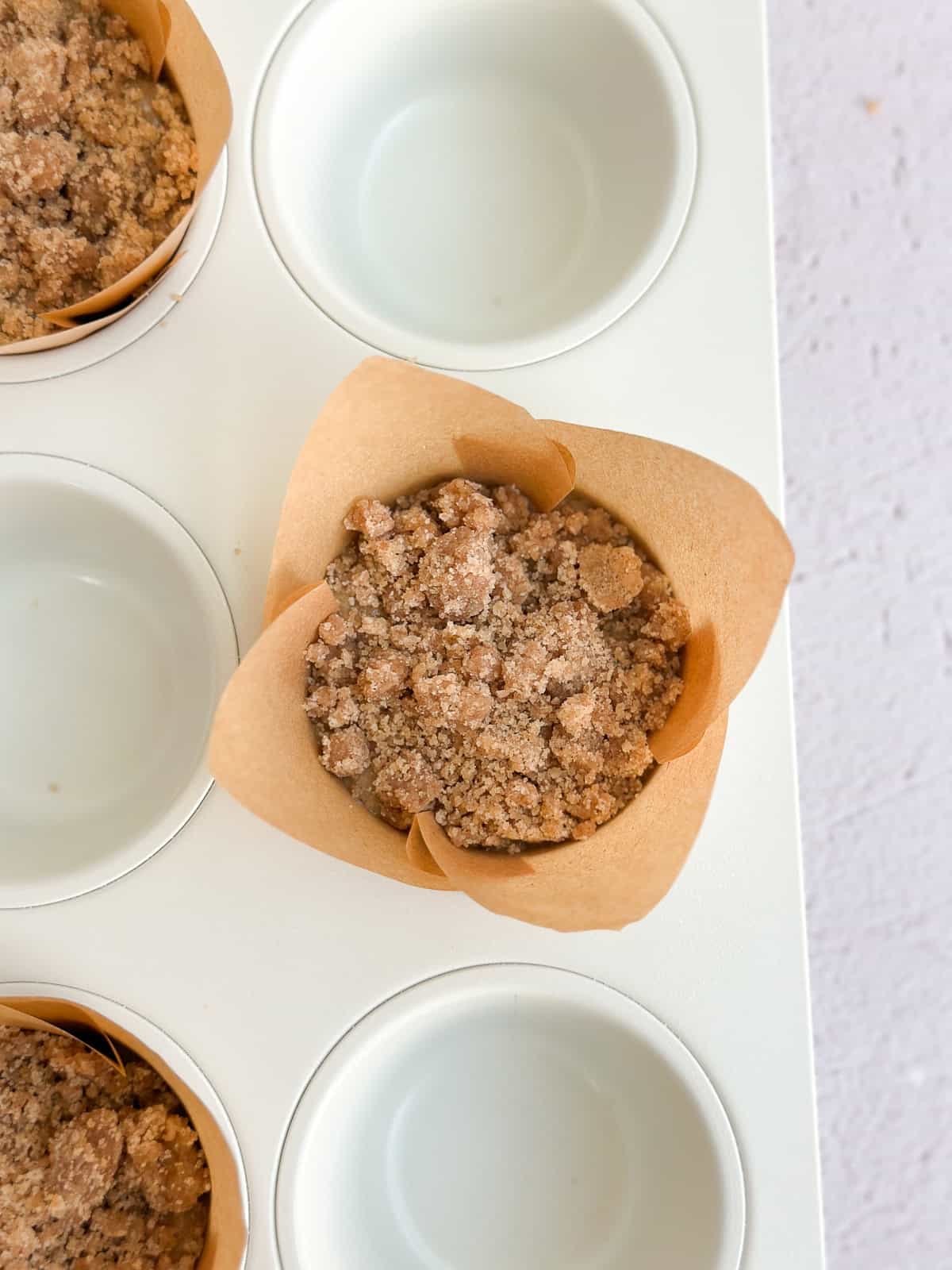 a closeup of everything in the muffin cup before baking.