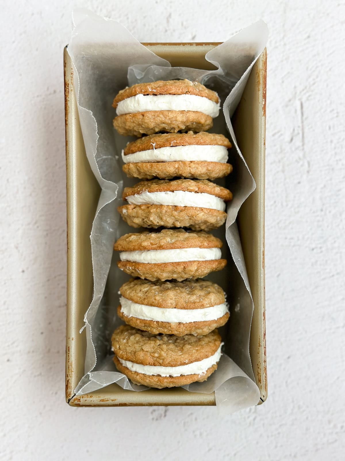 6 of the oatmeal cream pie cookies in a box to show the layers.