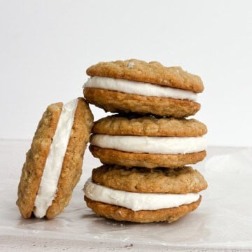 Oatmeal Cream Pie cookies stacked on top of each other.