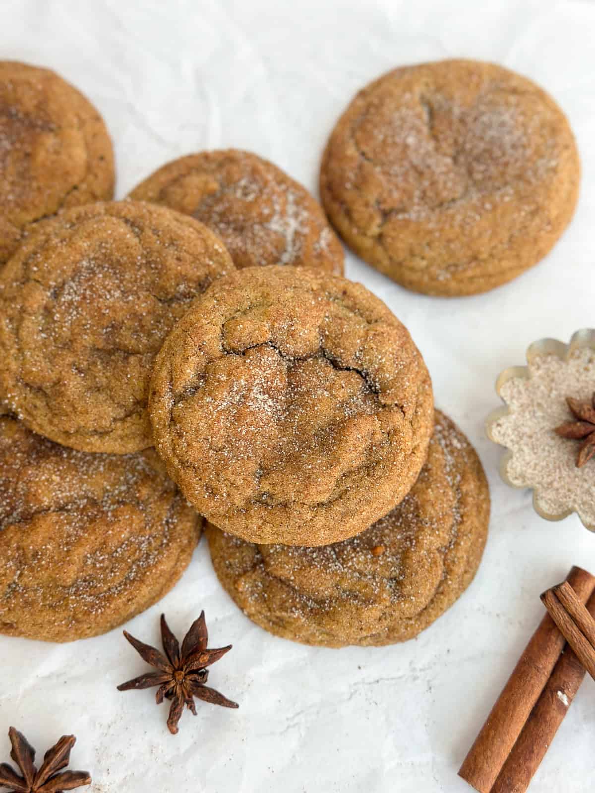 all of the brown butter pumpkin snickerdoodles laying near each other.