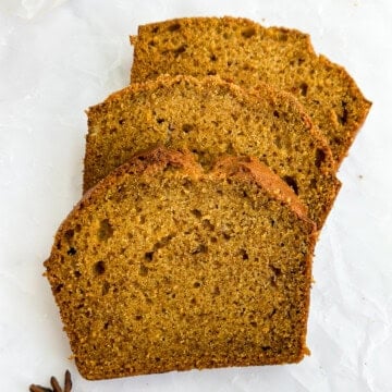 3 slices of the easiest pumpkin bread stacked on top of each other.