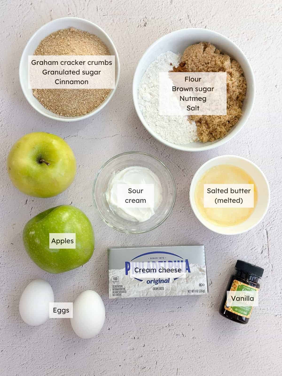 All of the ingredients needed for apple crumble cheesecake bars.
