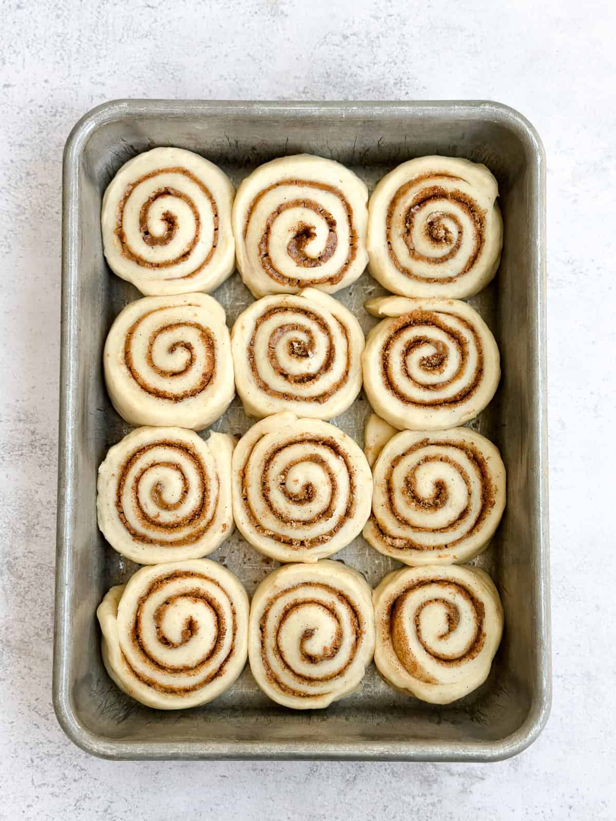 cinnamon roll dough after second rise, ready to bake.
