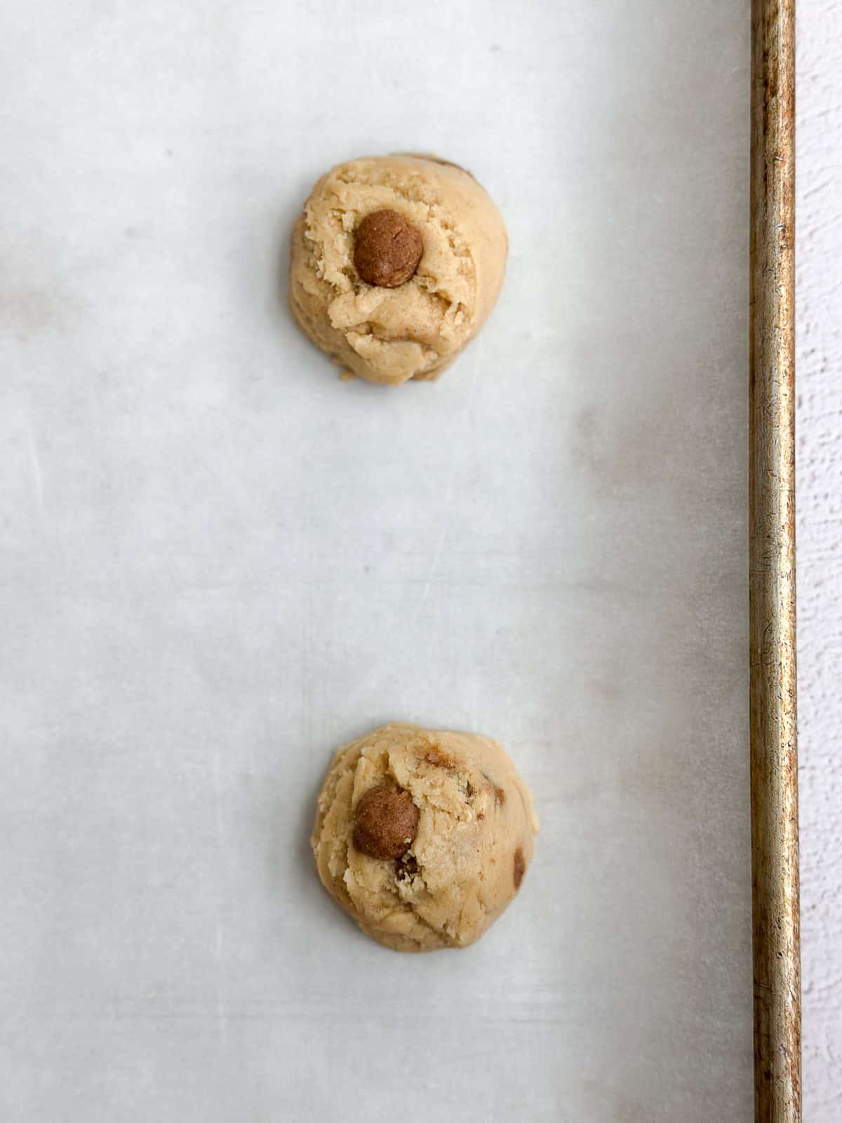 cookie dough balls with cinnamon roll filling mixed in.