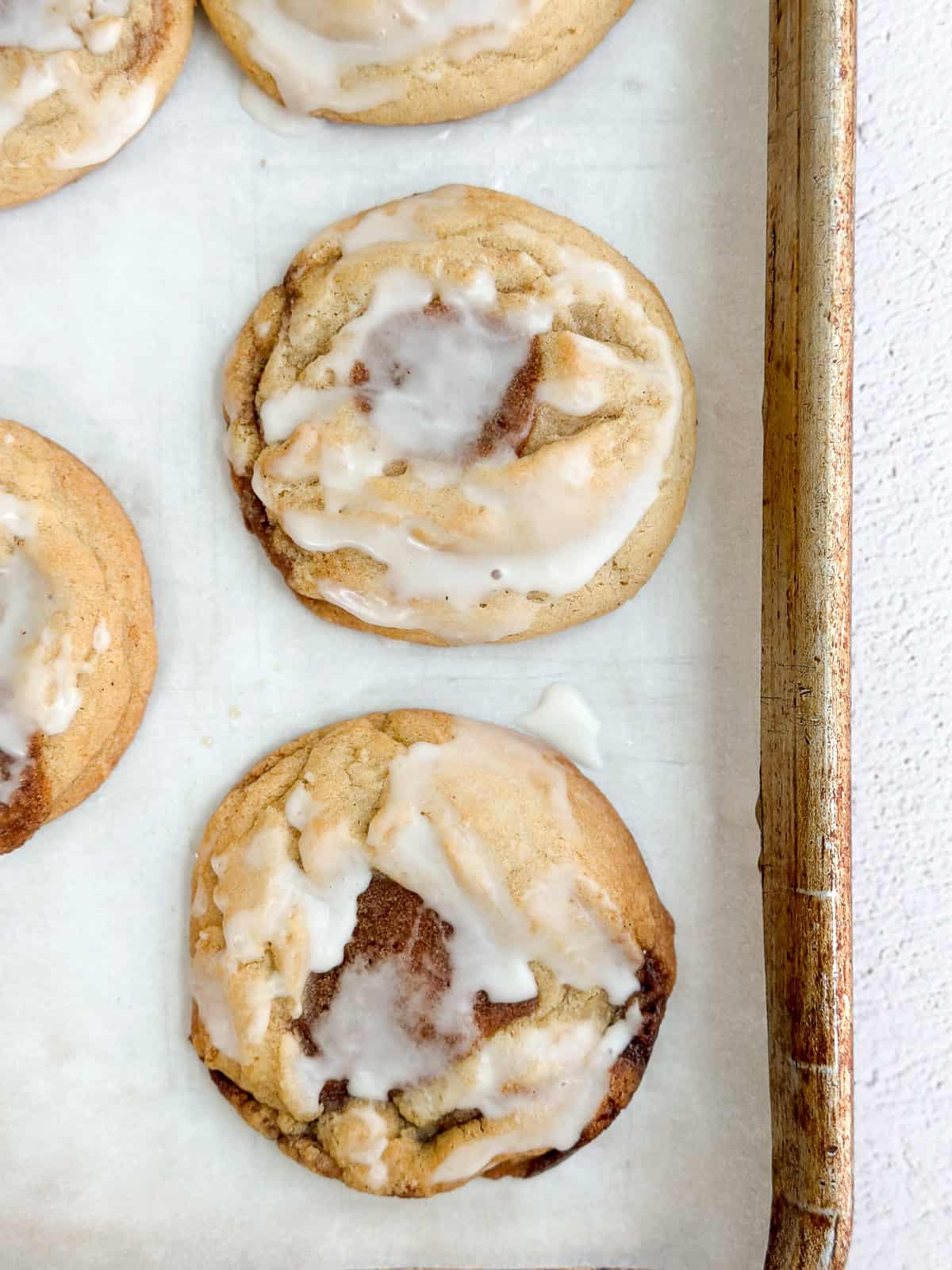 showing the cinnamon roll cookies after being glazed.