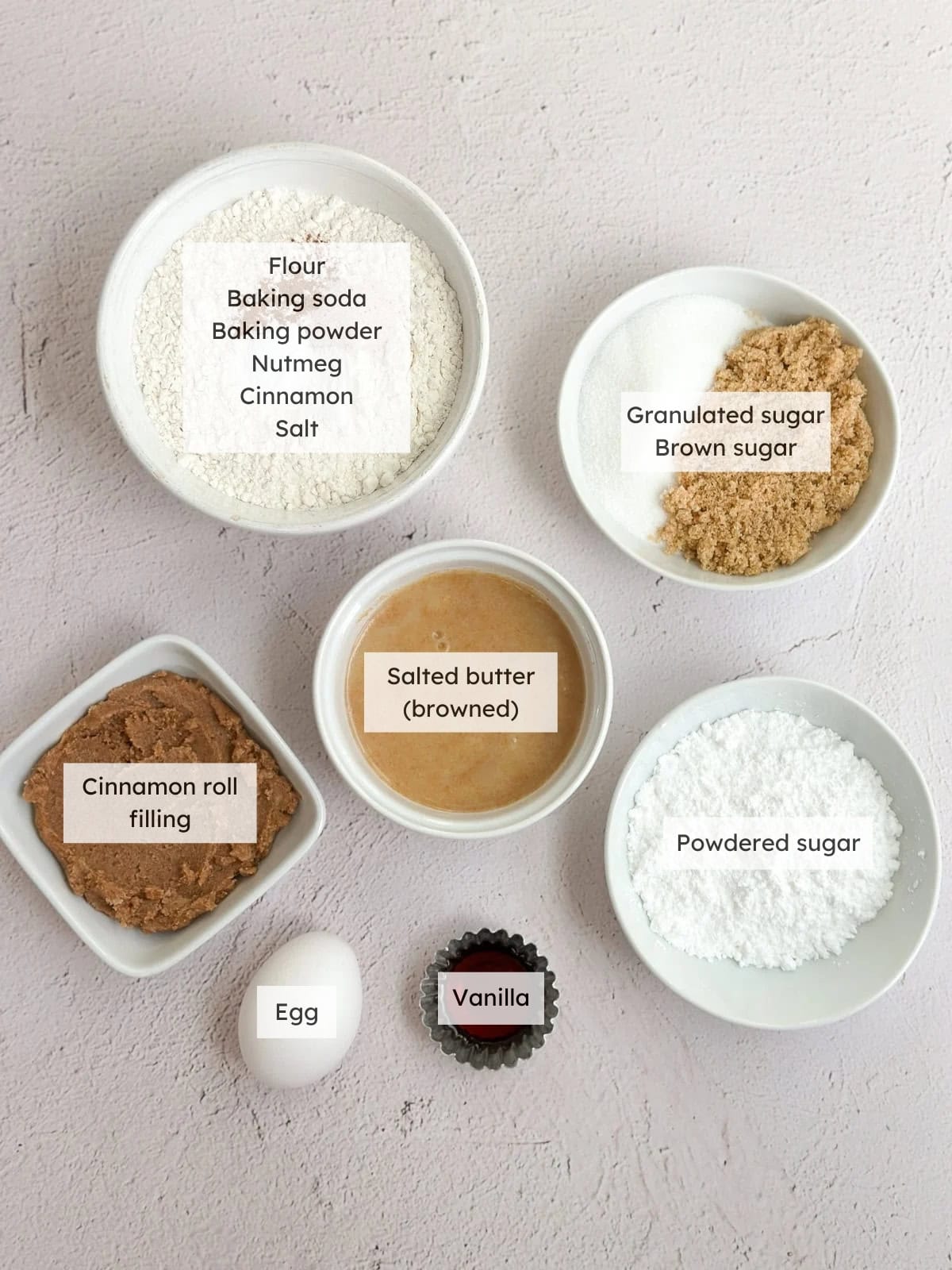 All of the ingredients needed to make cinnamon roll cookies.