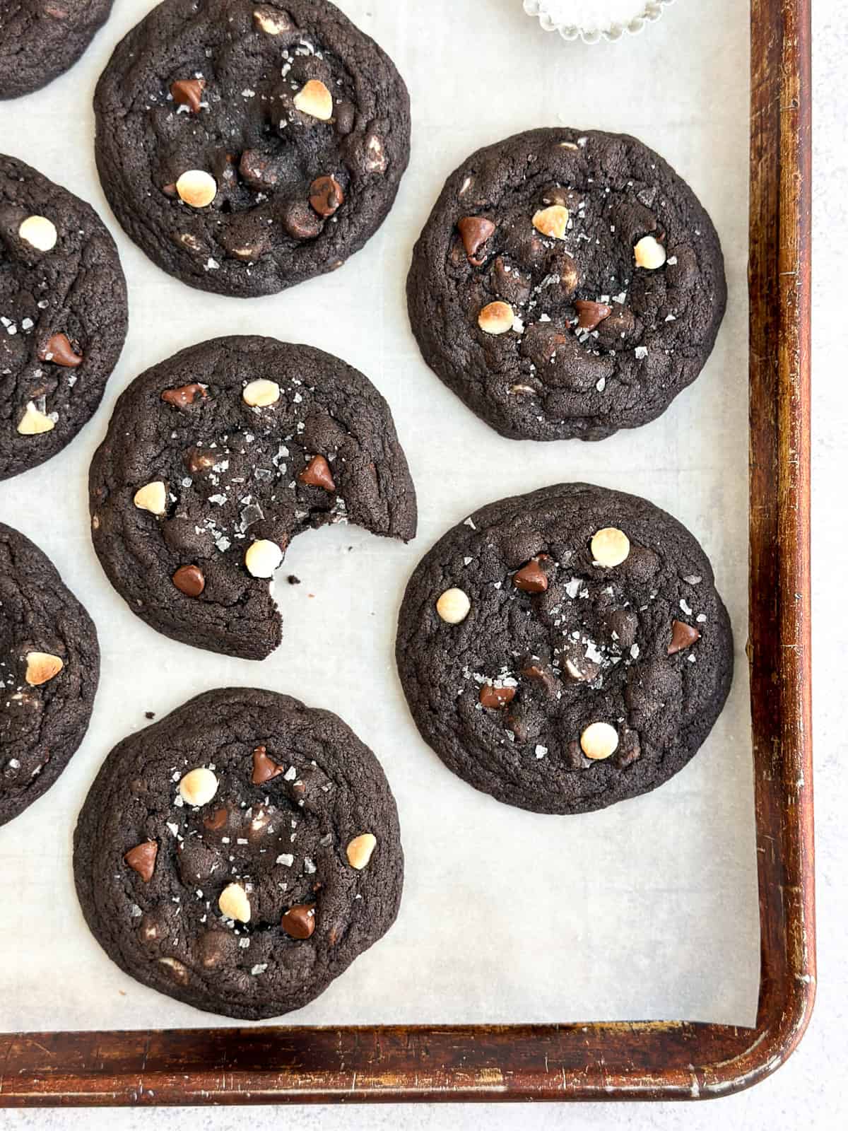 a bunch of inside out chocolate chip cookies on a baking sheet.