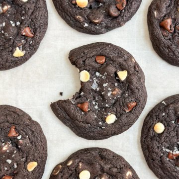 a bite missing from an inside out chocolate chip cookie.