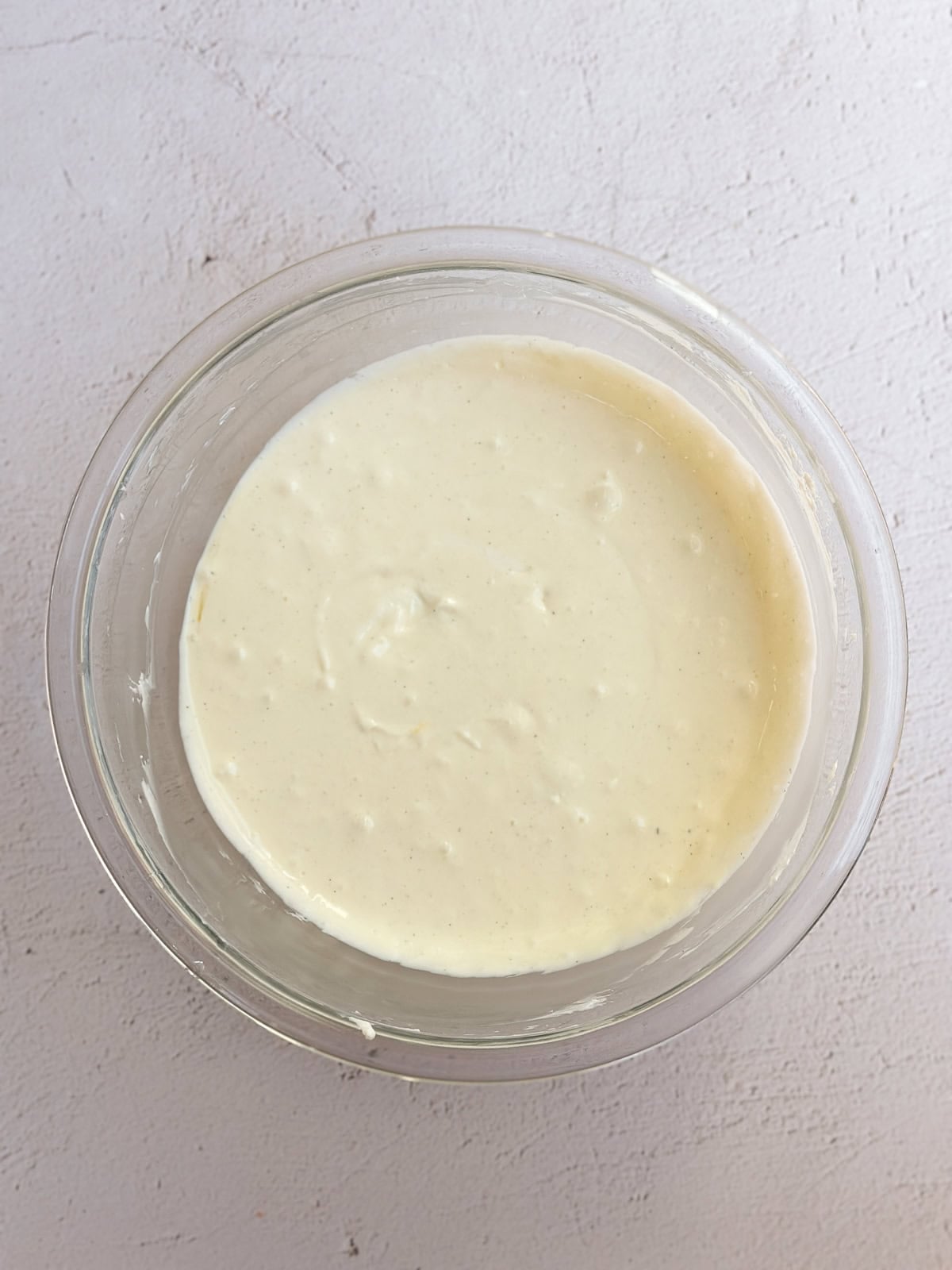 cheesecake filling mixed together in a bowl.