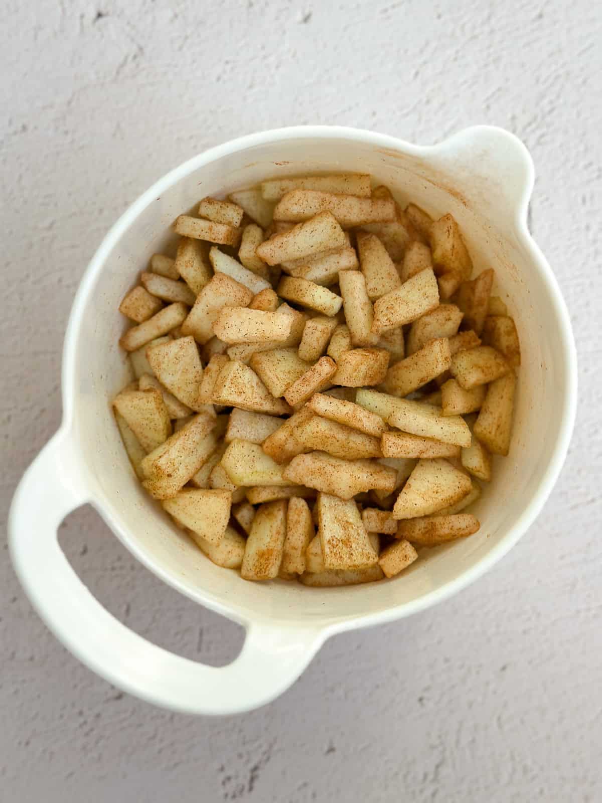 diced apples mixed with sugar and cinnamon.
