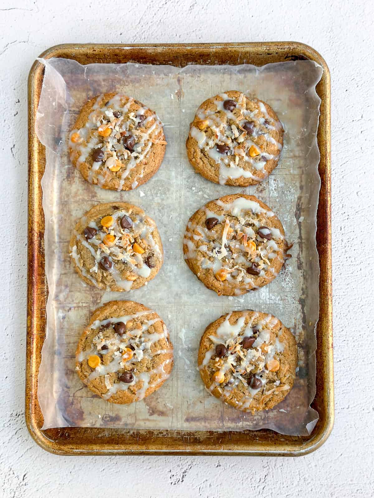 6 hello dolly cookies on a baking sheet.