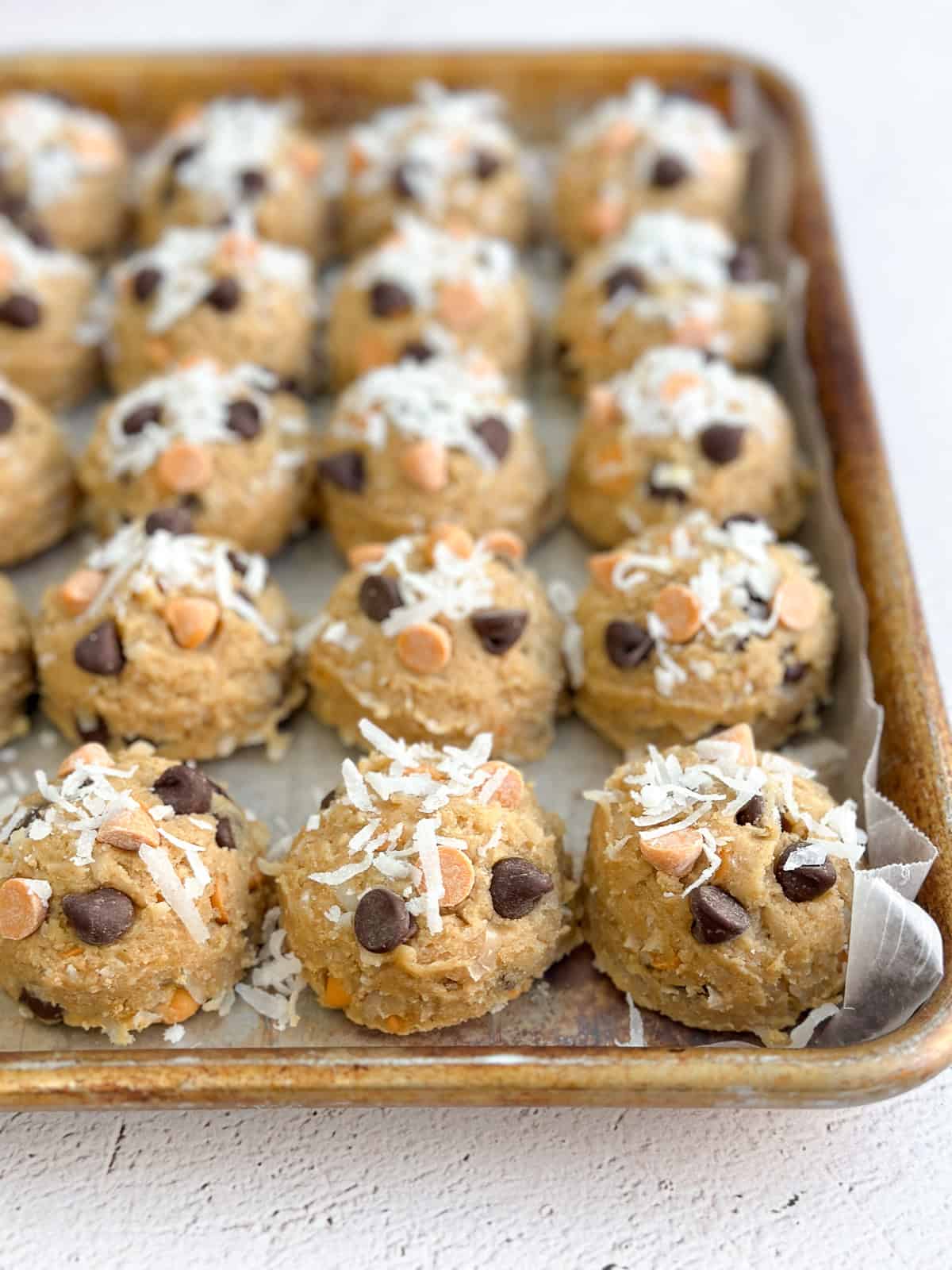 hello dolly cookie dough on a baking sheet.
