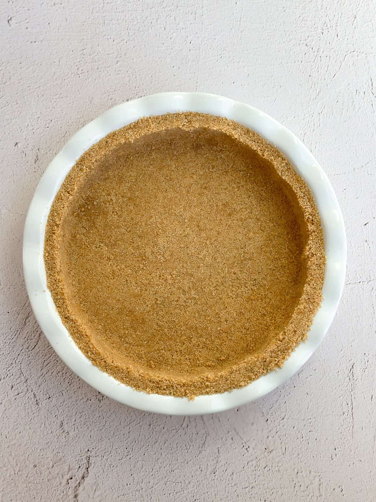 the graham cracker crust pressed into the pie plate.