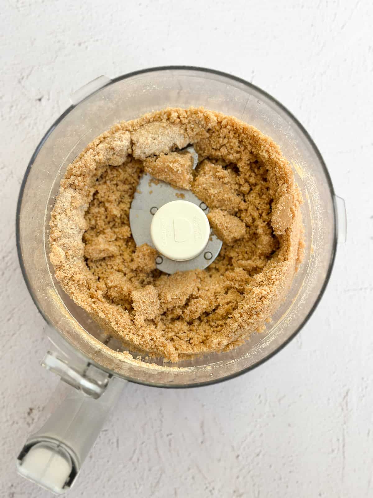 the graham cracker crust inside the food processor.