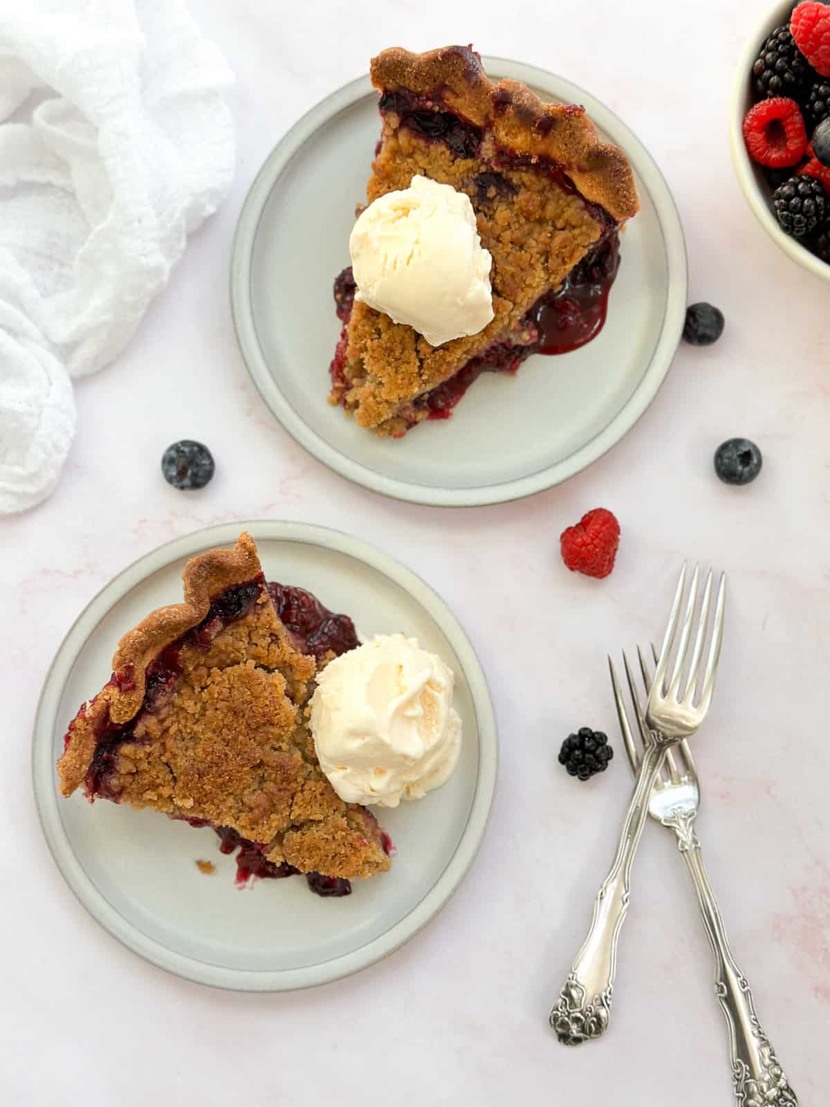 two slices of pie on two different plates.
