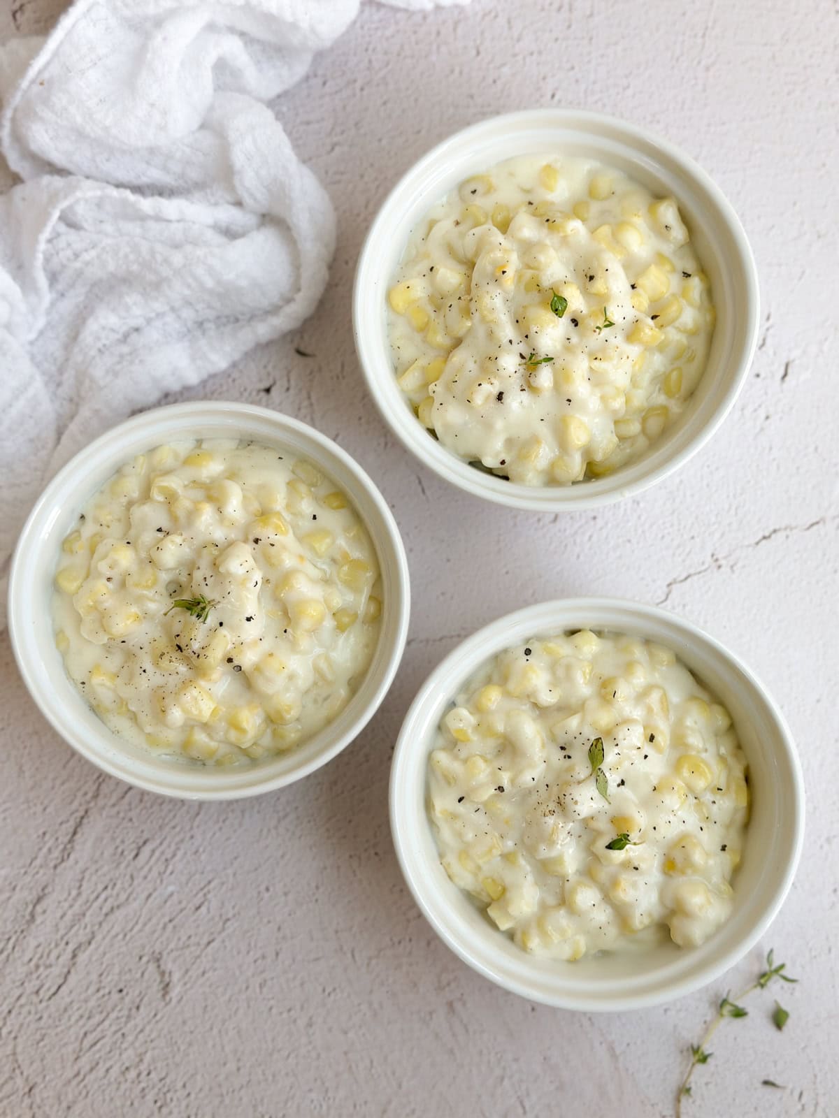 3 bowls filled with this easy creamed corn.
