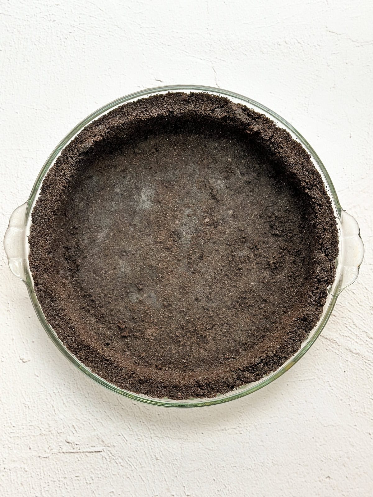 oreo crust baked in a pie plate.