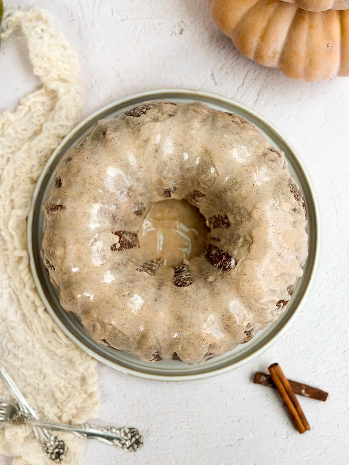 the pumpkin bundt cake with the glaze drizzled on top.