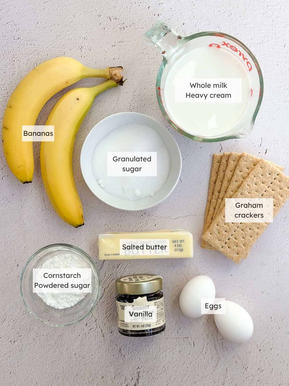All of the ingredients needed to make banana cream pie with graham cracker crust.