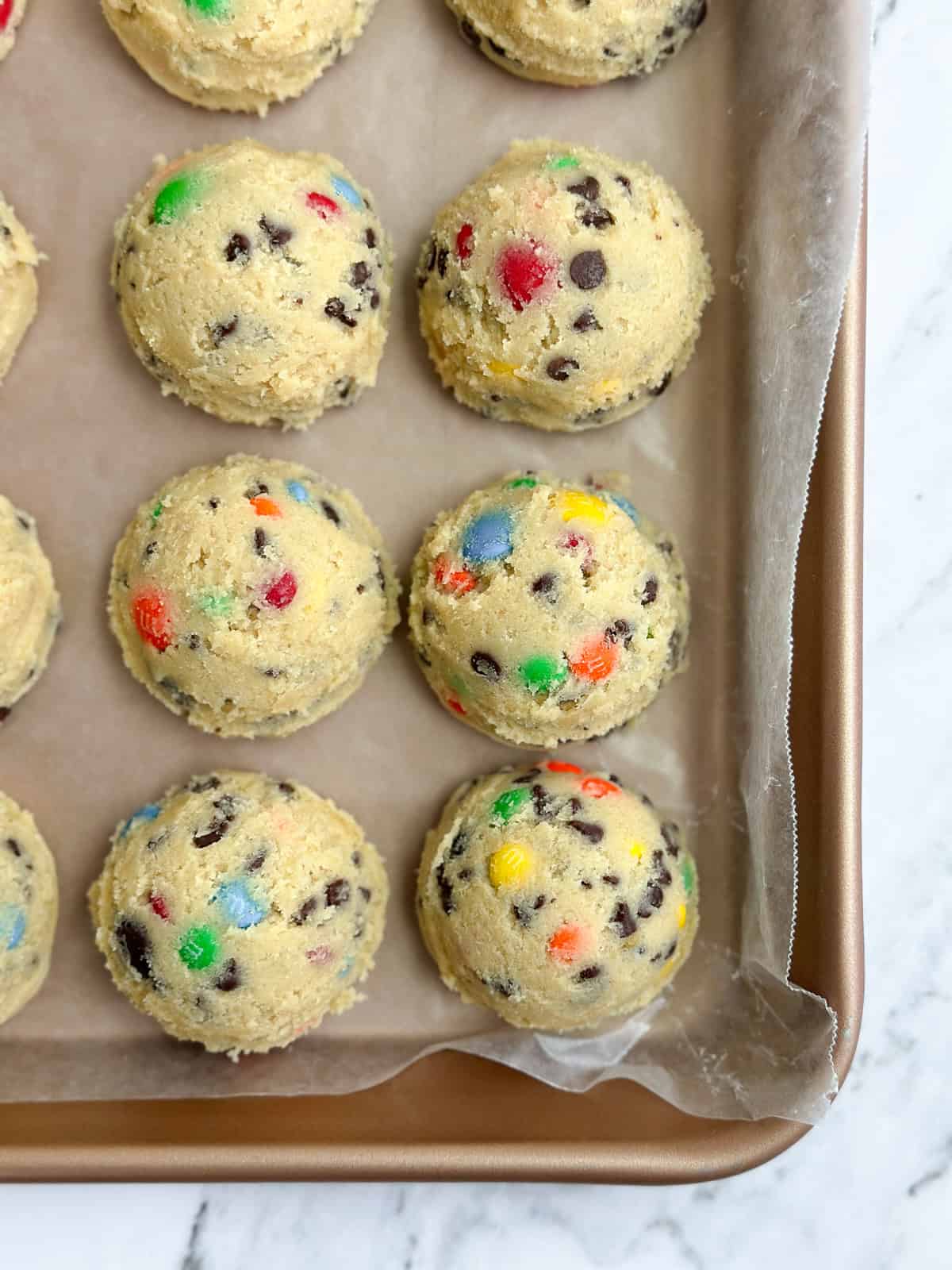 cookie dough balls all in a row.
