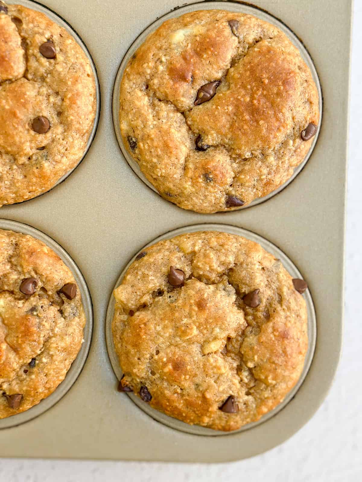 a close up of a muffin in the baking tin.